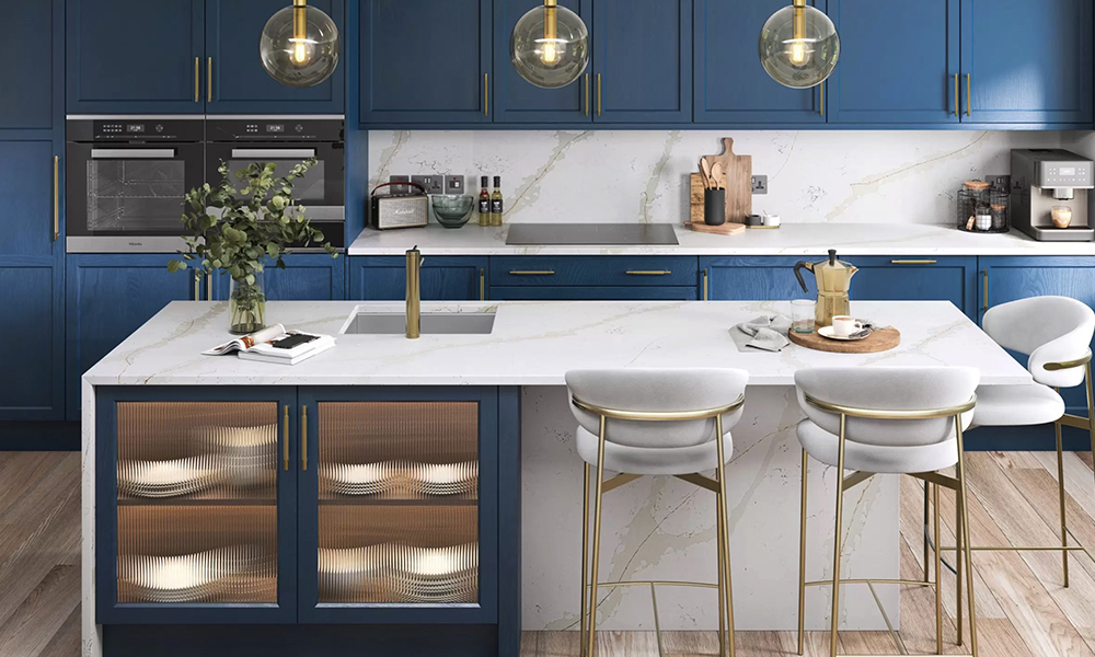 White Quartz Island and worktops with Dark blue Kitchen cupboards. from The Granite Company Direct, number 1 for Granite and Quartz worktops direct to the customer in Stoke, cheshire and the Northwest, England.