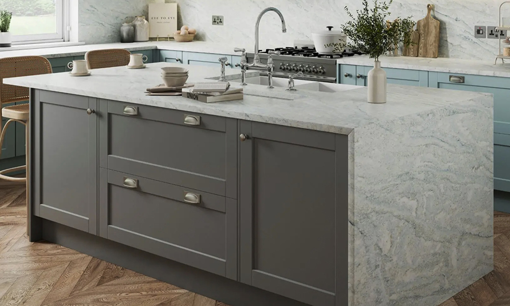 Full quartz kitchen surfaces and slashbacks finished off with grey cupboards, from The Granite Company Direct, number 1 for Granite and Quartz worktops direct to the customer in Stoke, cheshire and the Northwest, England.